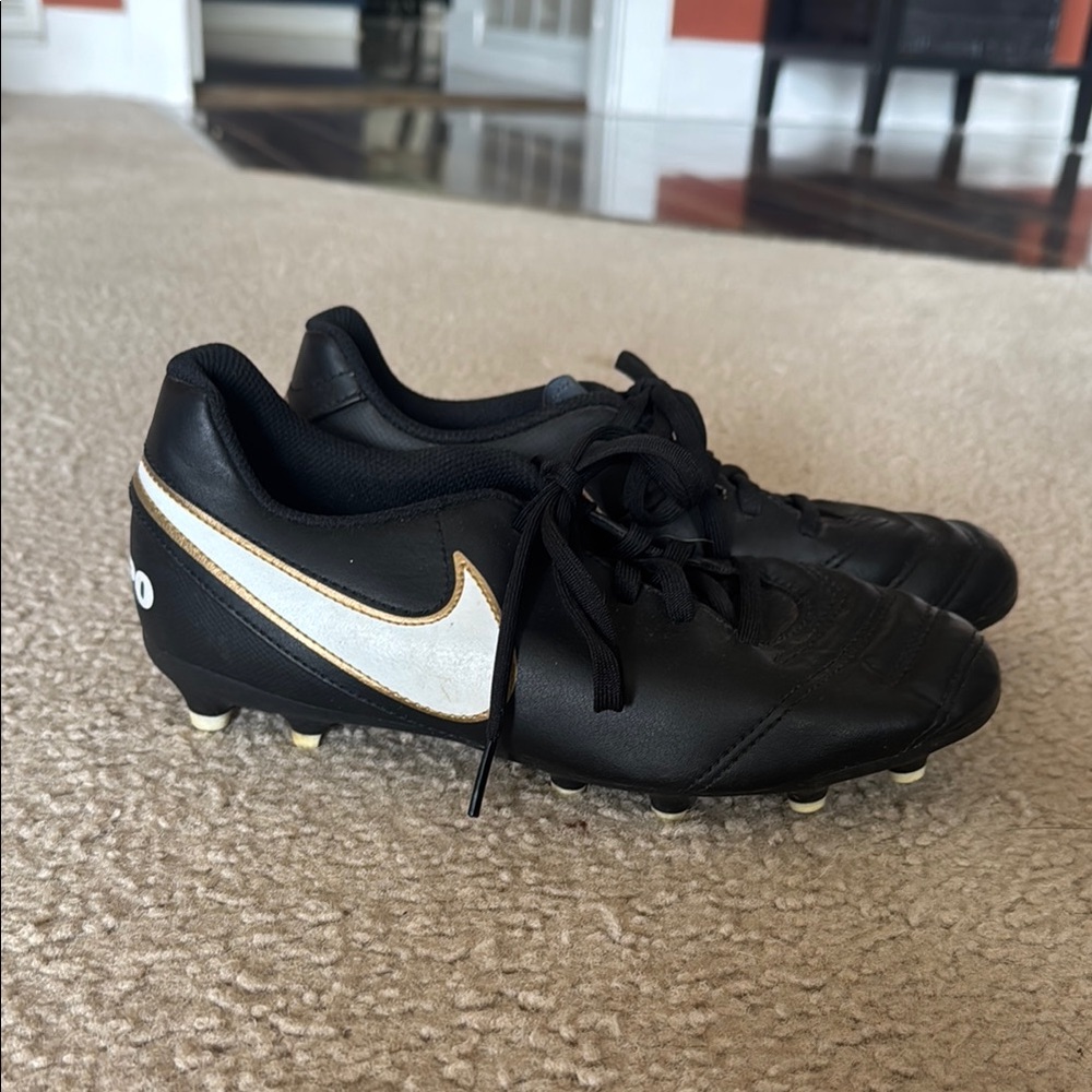 Nike Black Youth Tiempo Cleats with White and Gold Accents